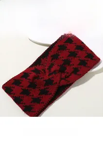 Detail of red and black houndstooth knitted headband with central twist design