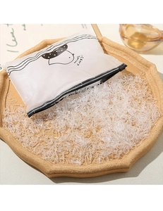 Transparent TPU hair ties in bulk with a frosted zip lock bag on a tray
