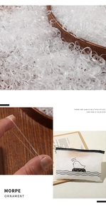 Elastic clear white disposable hair bands in a cartoon duck zipper bag packaging