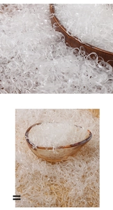 Macro detail of high-elasticity transparent mini hair bands in a wooden bowl