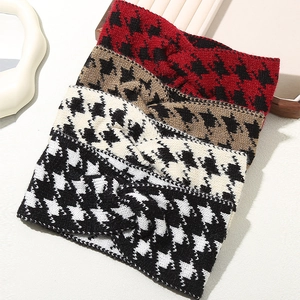 Set of four knitted houndstooth headbands with twisted knot design in various colors