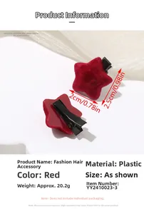Detailed view of red velvet star hair clips with 2cm x 2.5cm size dimensions displayed
