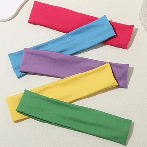 Five candy-colored elastic sports headbands in pink blue purple yellow and green