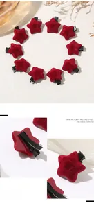 Close-up of red star hair clips with soft flocking texture and metal duckbill clamps