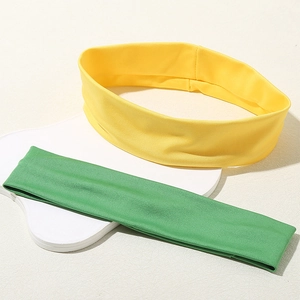 Elastic candy-colored sports headbands in yellow and green for yoga and fitness