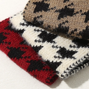 Chic houndstooth knitted headband for women in red, black, and white cozy textures