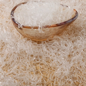 Transparent high-elastic disposable hair bands in a stylish amber glass bowl display