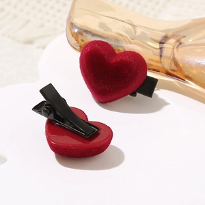Elegant red flocked heart-shaped hair clips with black metal duckbill grip for women