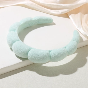 Padded cloud-style mint green headband with puffy segments for a voluminous look