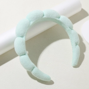 Padded mint green sponge headband with soft textured towel fabric in wavy cloud design