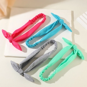 Elastic ribbed knit bow headbands in rose, light blue, grey and mint green colors