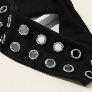 Punk style black knit headband featuring double rows of silver metal eyelets