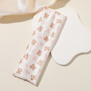 Elastic white satin headband featuring cute cartoon bear and pink bow patterns
