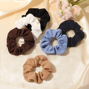 Set of 6 solid ribbed knit scrunchies in assorted neutral colors for ponytails