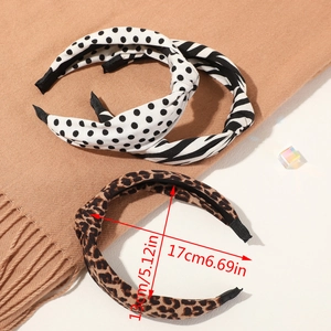 Close-up of knotted headbands in leopard, polka dot and zebra prints showing 13cm width