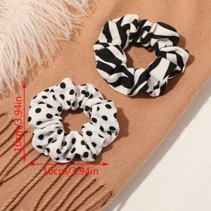 Set of two black and white zebra and polka dot scrunchies measuring 10cm in diameter
