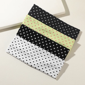 Set of 4 elastic polka dot yoga headbands in black, white, and neon green colors