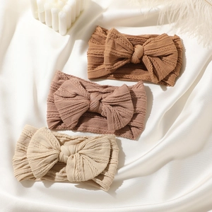 Set di 3 fasce elastiche per neonati in maglia jacquard con grandi fiocchi morbidi