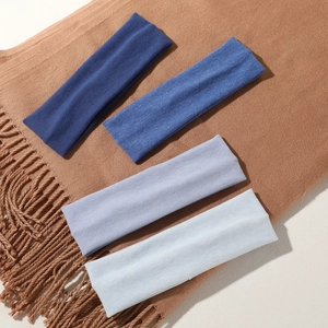 Set of four elastic knitted wide headbands in various shades of blue for women