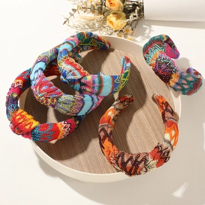 Detail of bohemian hollow linen knit headbands with ethnic floral embroidery patterns