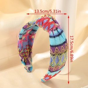 Detail view of colorful embroidered linen headband with size 5.31in x 6.89in markers
