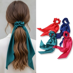Silk-like ribbon bow hair ties in four vibrant colors for elegant ponytails