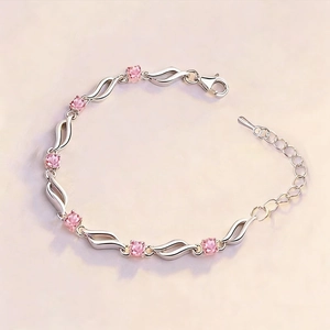 Elegant wave-link silver bracelet featuring pink square-cut crystal stones for women
