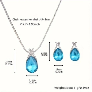 Detail view of blue teardrop crystal pendant and earrings with silver chain dimensions