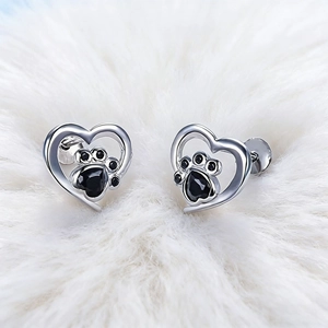Minimalist silver heart earrings with black pet paw print studs for dog lovers