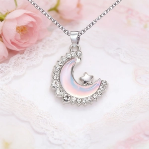 Silver star and moon necklace with iridescent crescent pendant and sparkling rhinestones