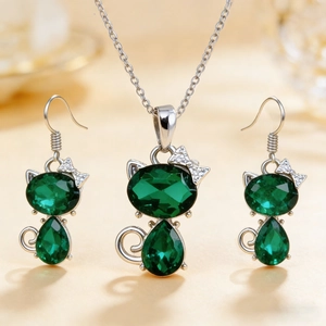 Silver cat jewelry set with heart-shaped green crystal necklace and matching earrings