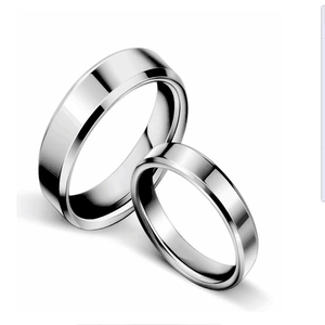 Polished silver stainless steel minimalist couple rings with smooth rounded edge finish