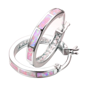 Detail shot of silver hoop earrings featuring pink opal inlay with snap-post closure