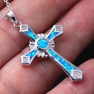 Elegant silver cross necklace with vibrant blue opal and sparkling zircon accents