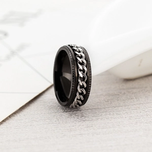 Macro shot of rotatable stainless steel chain ring with engraved industrial gear edges
