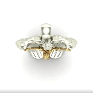 Detailed view of bicolor angel cross pendant with golden relief and silver wings