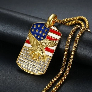 Detail of gold military tag pendant with American flag eagle and pave set cubic zirconia