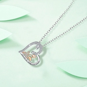 Detail of heart pendant with rose gold tulip and I love you for always and forever engraving