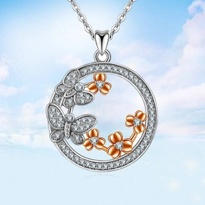 Detail of silver heart flower pendant with rose gold accents and pavé-set zircons