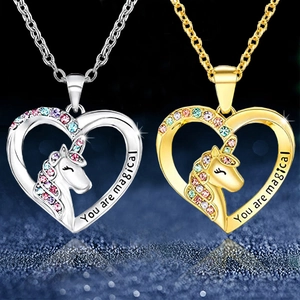 Golden and silver unicorn heart pendant necklace set with colorful crystals and magical engraving