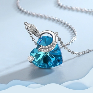 Blue crystal heart pendant necklace with silver feather detail and fine O-chain link