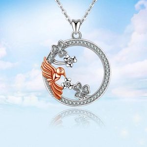 Elegant round hummingbird and flower diamond pendant necklace in silver and rose gold