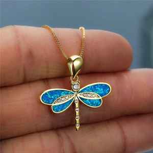 Golden dragonfly pendant necklace with blue opal stones and sparkling zircons for women
