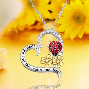 Heart pendant necklace with ladybug, gold flowers and I love you to the moon engraving