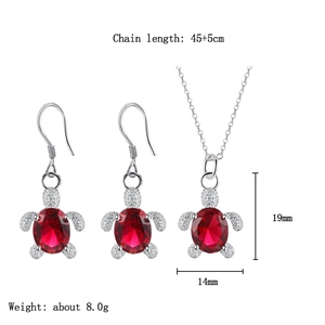 Detail view of turtle jewelry set with red crystals, chain length 45+5cm and 19x14mm pendant
