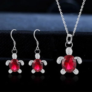 Silver turtle jewelry set with faceted red crystal necklace and matching hook earrings