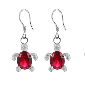 Chic silver turtle drop earrings featuring a large oval red faceted gemstone crystal