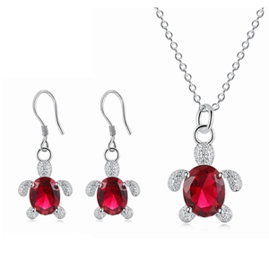 Elegant silver turtle jewelry set with oval red crystals and sparkling accents