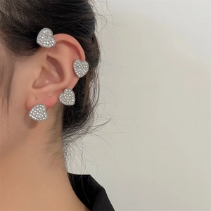 Sparkling silver heart ear cuff and stud set with pavé rhinestones on model