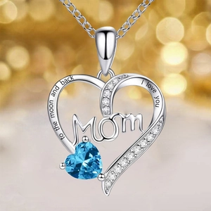 Detailed close-up of MOM heart necklace with blue gemstone and romantic engraving